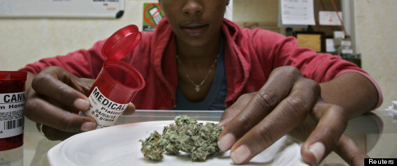 Union member Taylor displays medical marijuana during a media visit at the Venice Beach Care Center medical marijuana dispensary in Los Angeles, California
