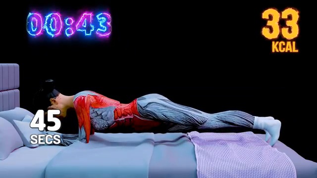 Position de planche sur les coudes réalisée sur le lit, illustrant l'exercice de renforcement statique pour le gainage.